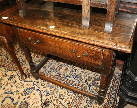 A late 17th century oak side table